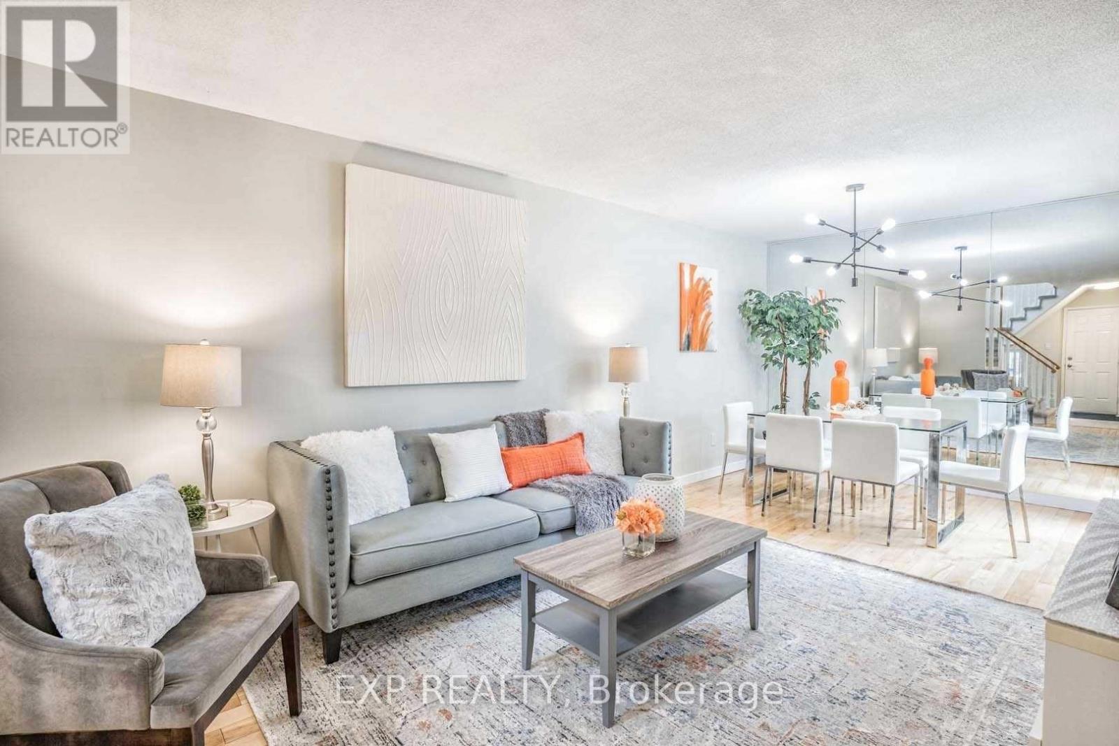 A living room with a grey couch and a coffee table.