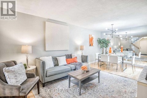 A living room with a grey couch and a coffee table.