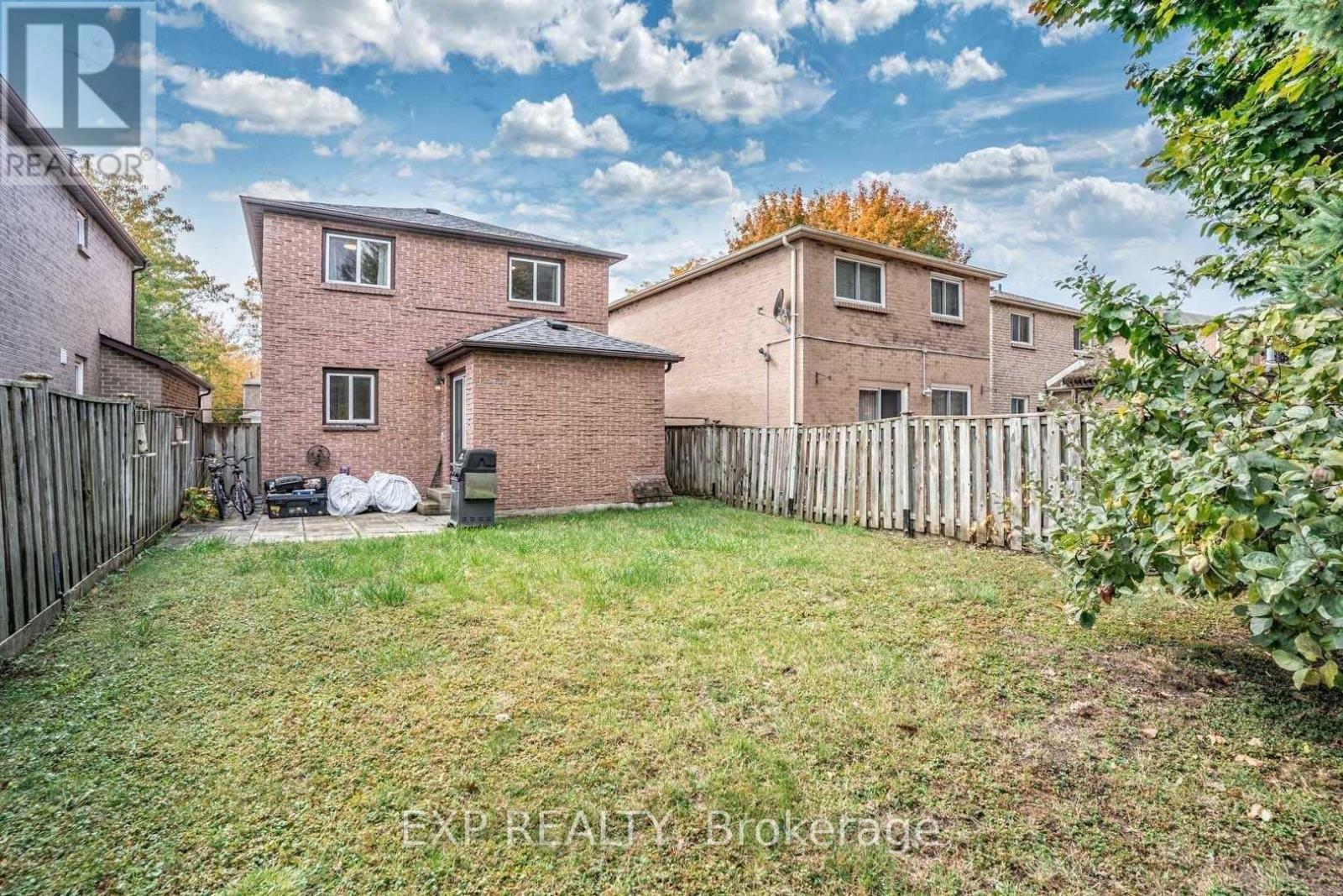 A house with a fence and a yard is for sale.
