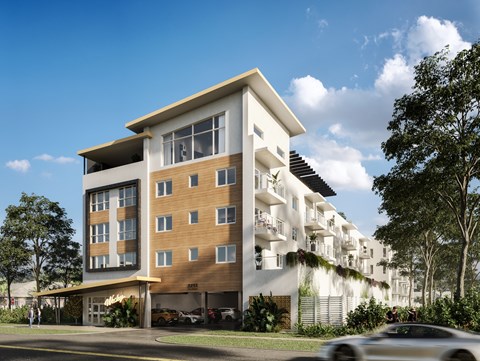 A modern multi-story building with a balcony on the second floor.