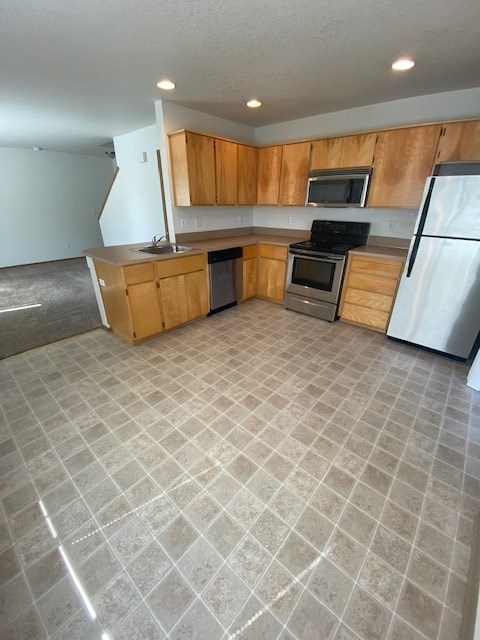 A kitchen with wooden cabinets and a tiled floor.