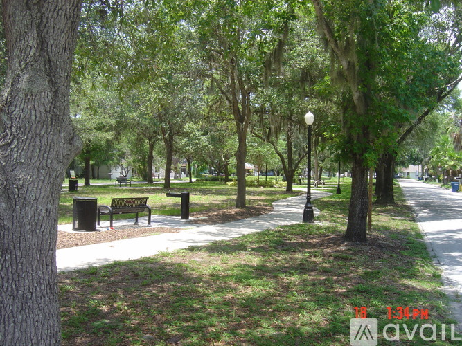 A park with trees and benches is shown.