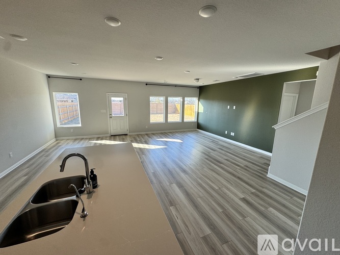 A kitchen with a sink and a window.