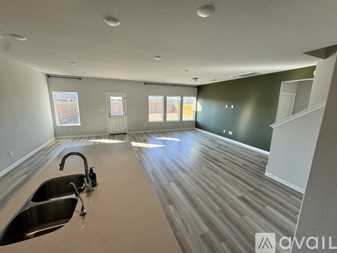 A kitchen with a sink and a window.