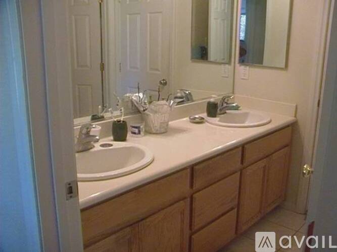A bathroom with a white countertop and a sink.