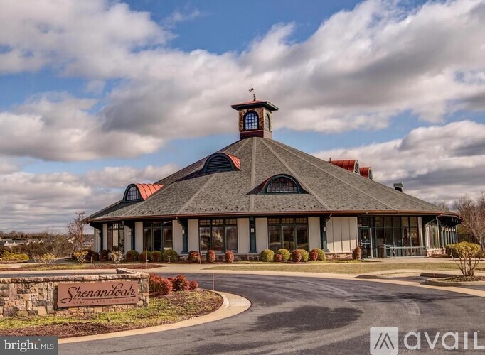 A building with a sign that says Shenandoah in front of it.