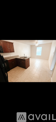 A kitchen with brown cabinets and a white countertop.