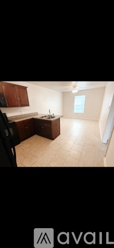 A kitchen with brown cabinets and a white countertop.