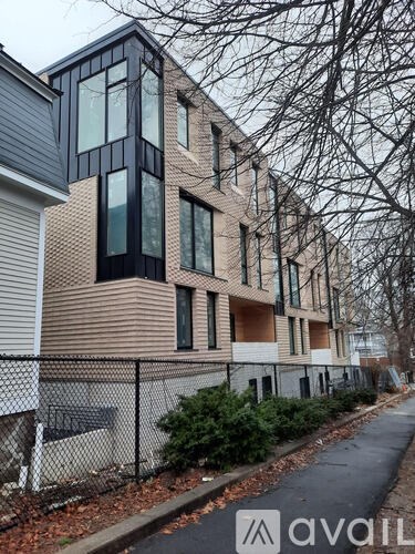 A modern building with a fence in front of it.
