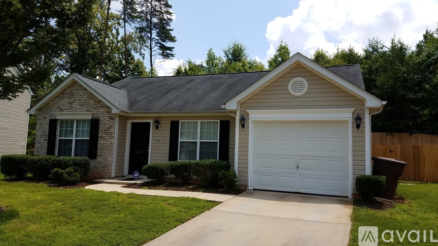 A house with a garage is for sale.