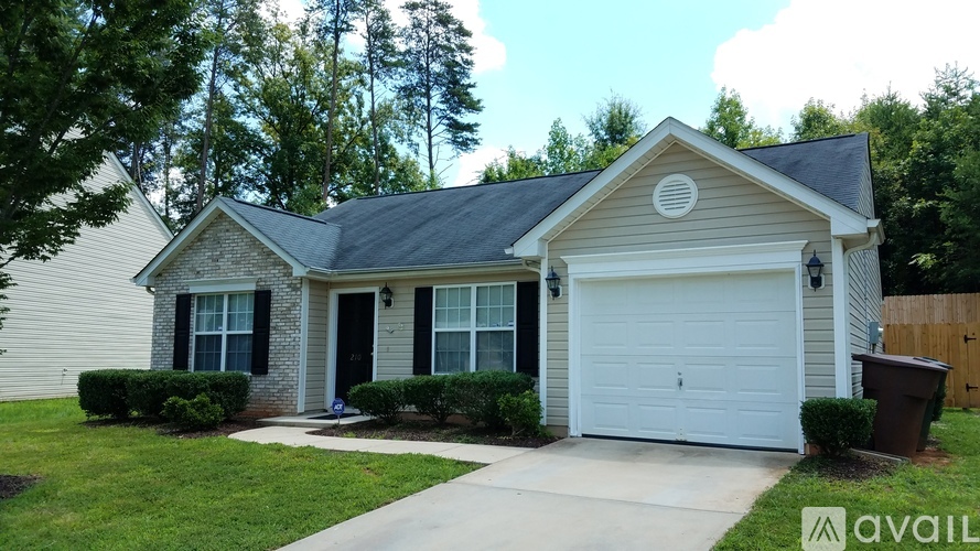 A house with a garage is for sale.