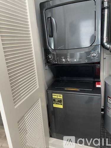 A stainless steel oven with a digital display and control panel.