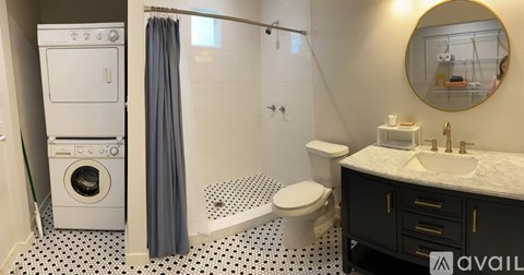A bathroom with a washer and dryer built in.
