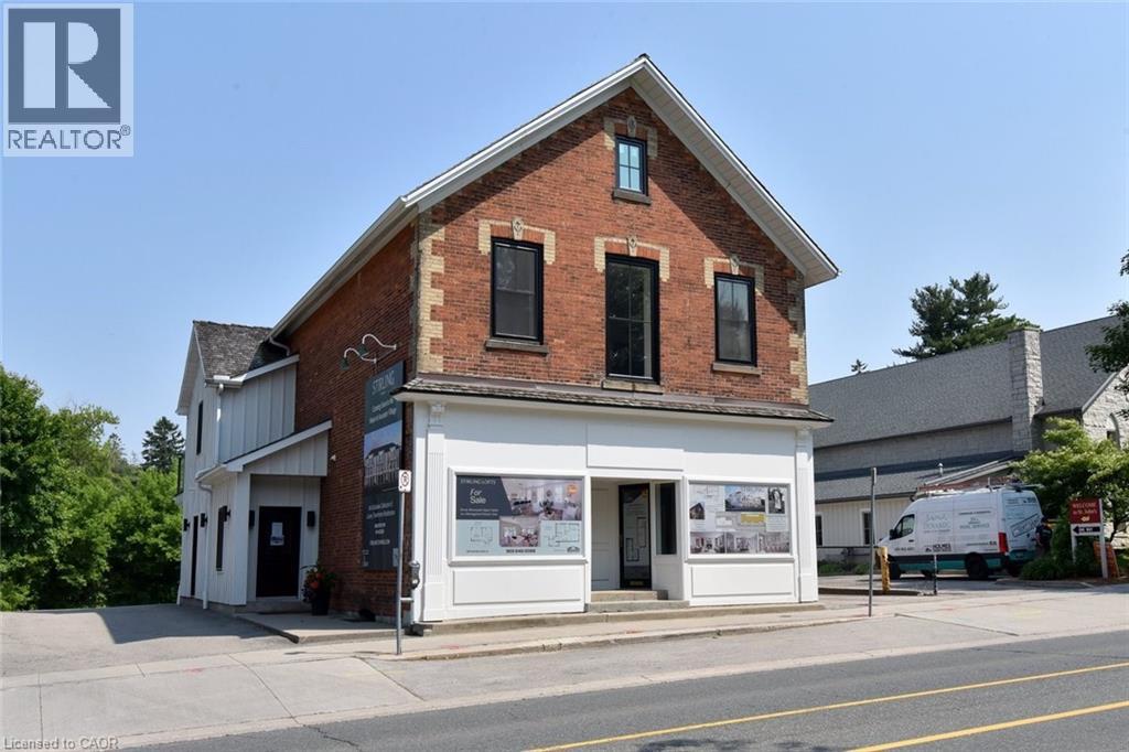A realtor office is located in a brick building.