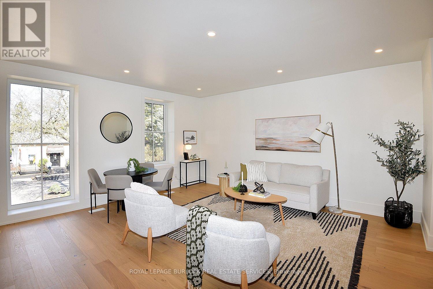 A living room with a white couch and a coffee table.