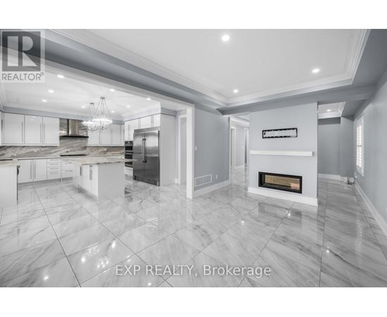 A modern kitchen with a marble floor and a fireplace.