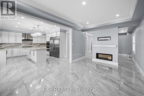 A modern kitchen with a marble floor and a fireplace.