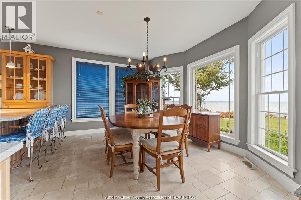 A dining room with a table set for six.
