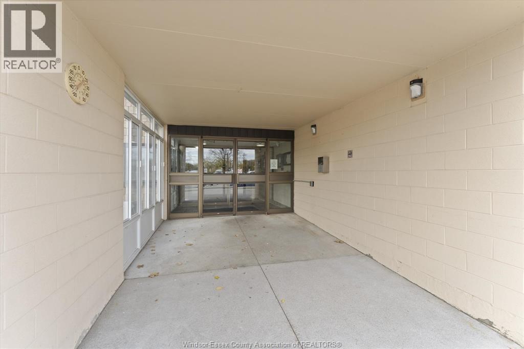 A hallway with a logo on the wall that says REALTOR.