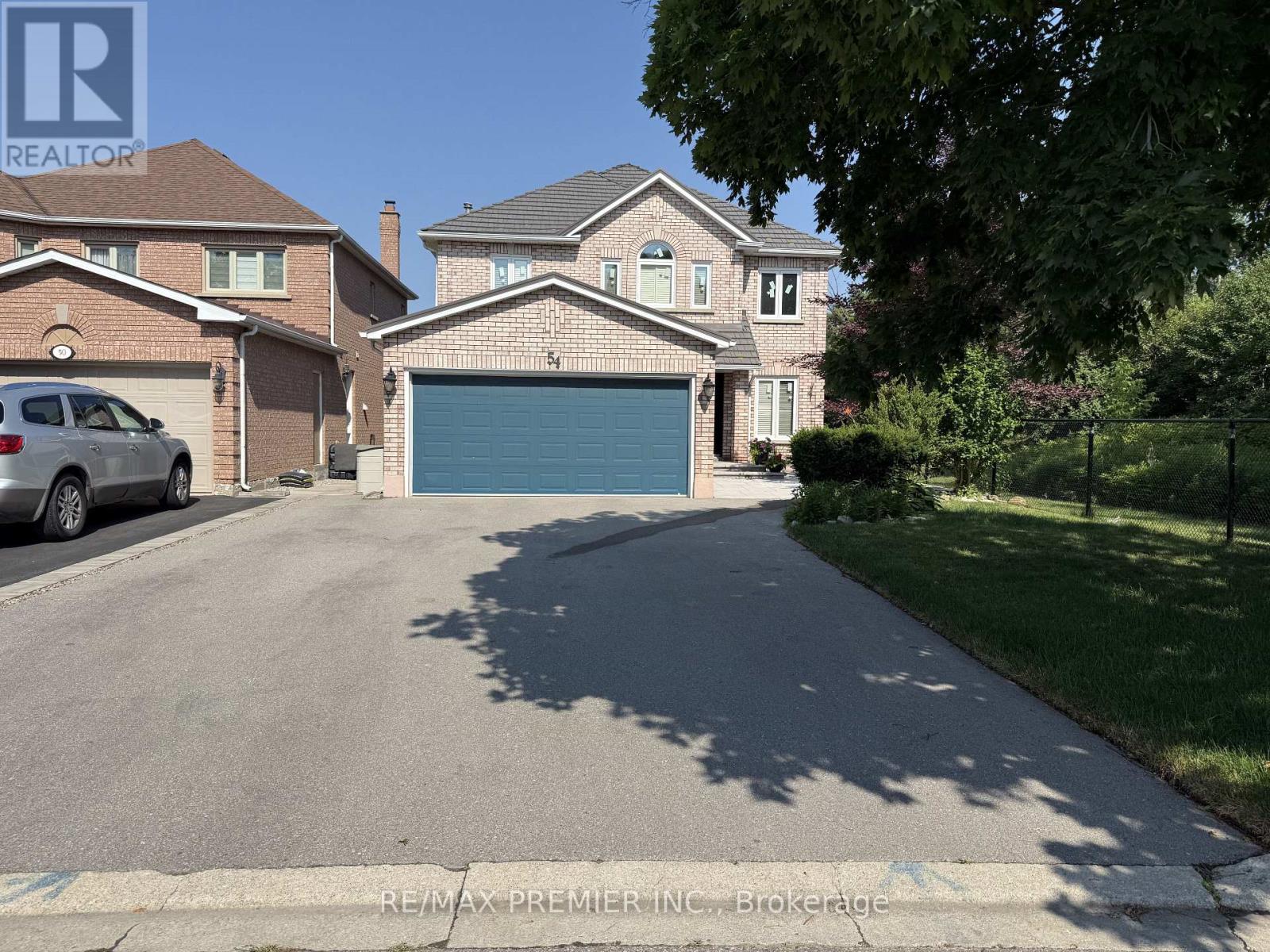 A house with a garage is for sale.