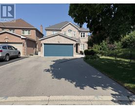 A house with a garage is for sale.