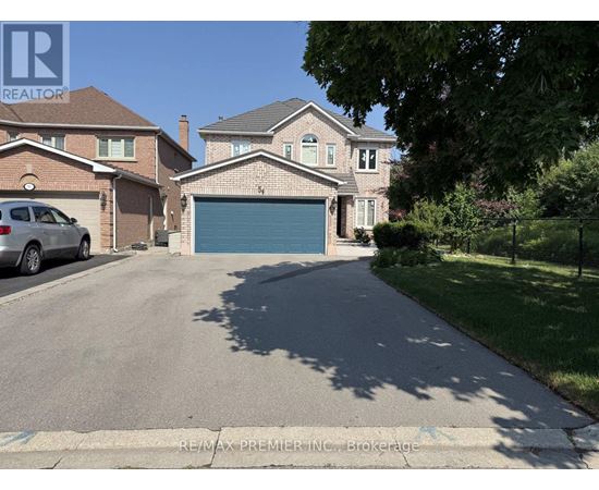 A house with a garage is for sale.