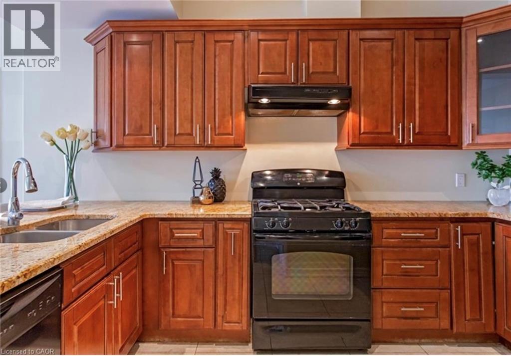 A kitchen with wooden cabinets and a black stove top oven.