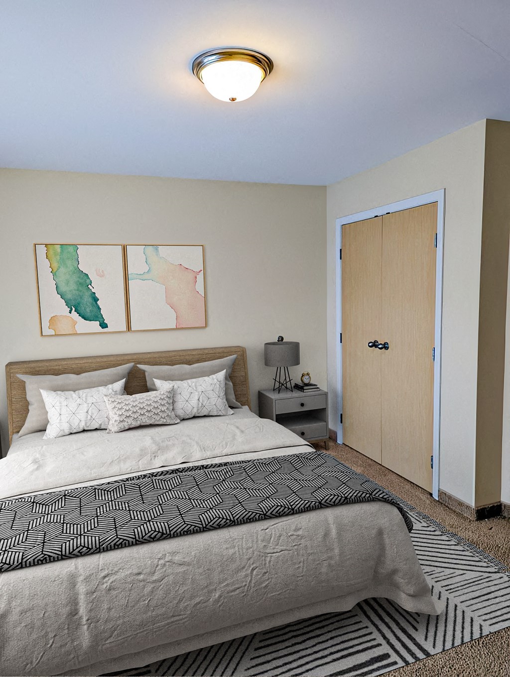 a bedroom with a bed and a door to a closet