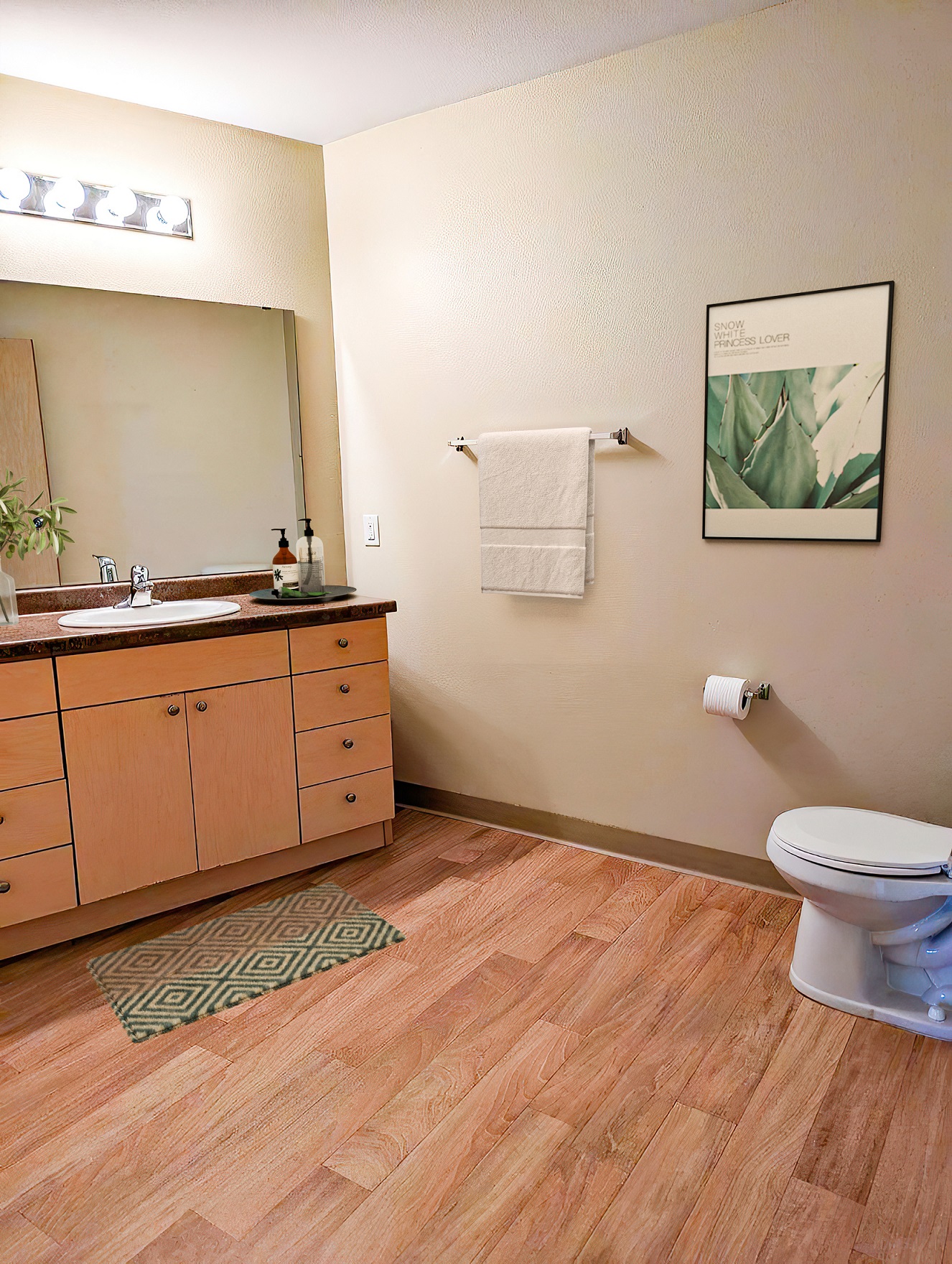 a bathroom with a toilet and a sink and a mirror