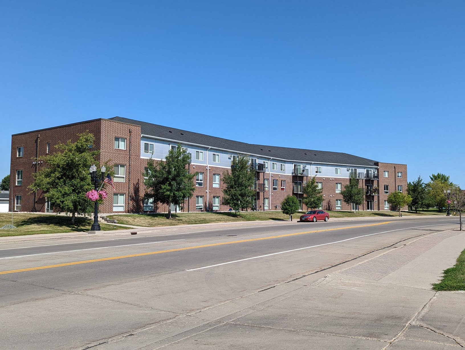 an apartment building on the side of a street