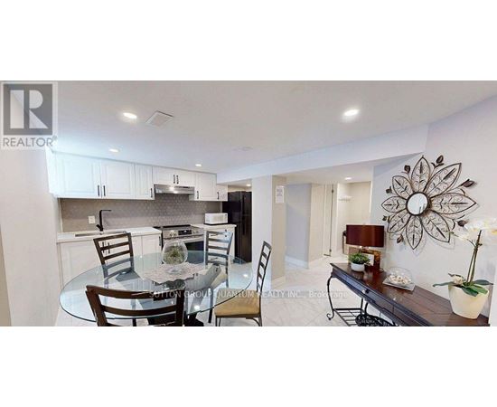 A modern kitchen with a glass table and chairs.