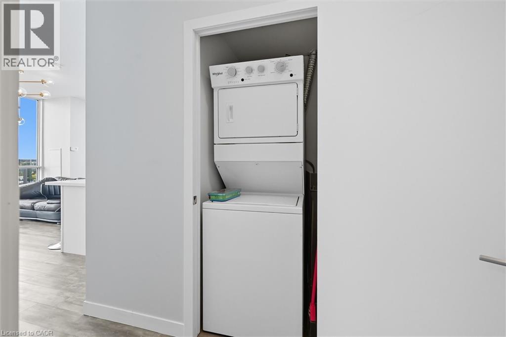 A white dishwasher is built into a wall in a kitchen.