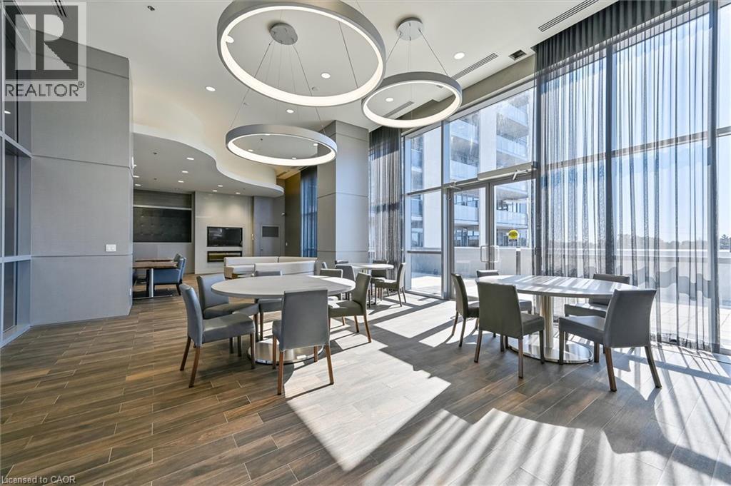 A modern dining room with a large table and chairs.