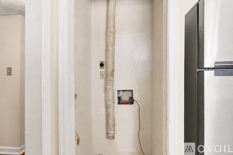 A bathroom with a sink and a mirror with lights above it.