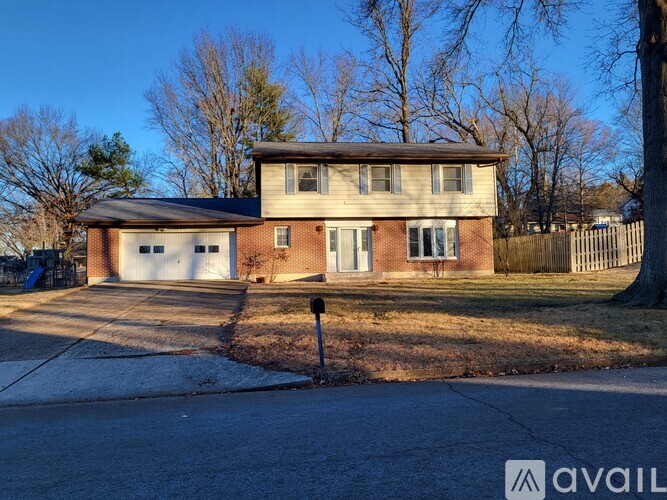 A house with a garage is for sale.