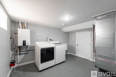 A kitchen area with a white oven and dishwasher.