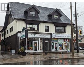 A building with a sign that says Top Family Restaurant Laundromat & Service.