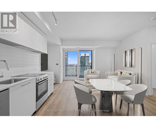 A modern kitchen with a dining table and chairs.
