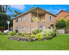 A house with a lawn and a sign that says RE/MAX ACE REALTY INC., Brokerage.