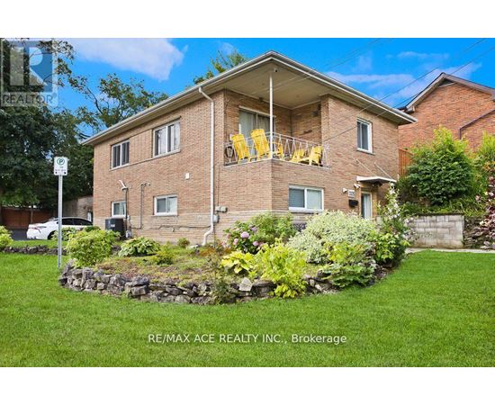 A house with a lawn and a sign that says RE/MAX ACE REALTY INC., Brokerage.