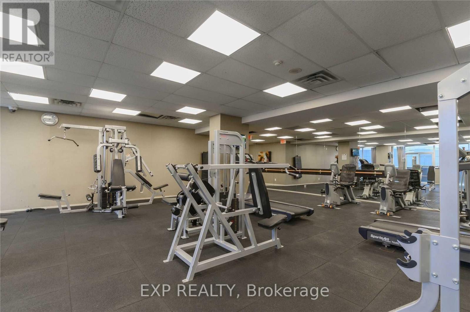 A gym with a variety of equipment including a leg press machine.