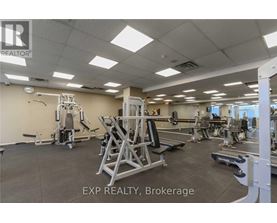 A gym with a variety of equipment including a leg press machine.