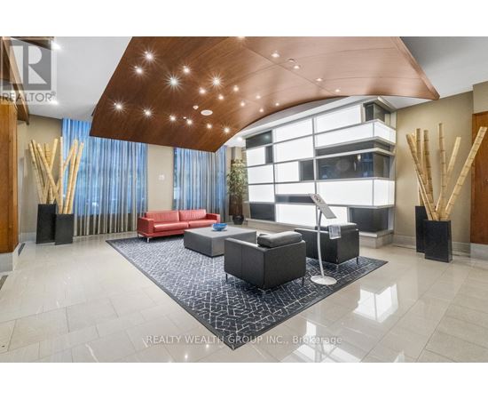 A modern living room with a red couch and a wooden ceiling.