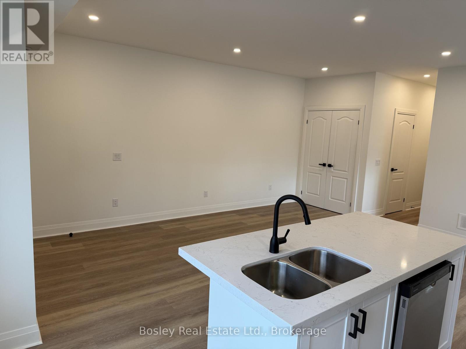 A kitchen with a sink and a countertop.