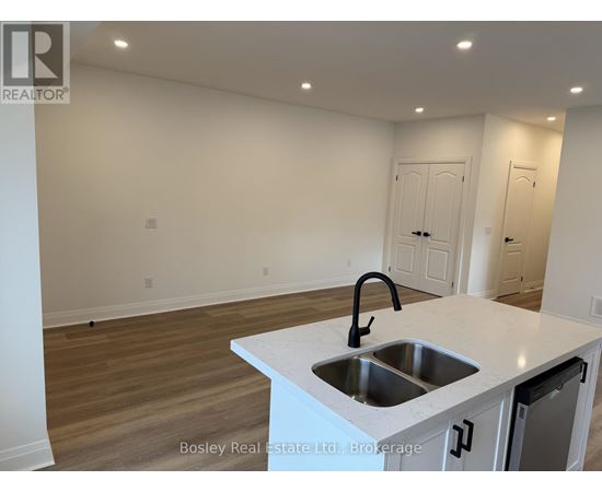 A kitchen with a sink and a countertop.