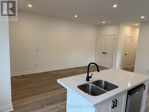 A kitchen with a sink and a countertop.