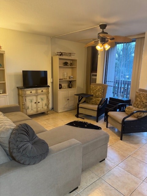 A living room with a grey couch and a television.