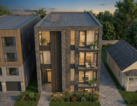 A modern two-story house with a balcony and a garage.