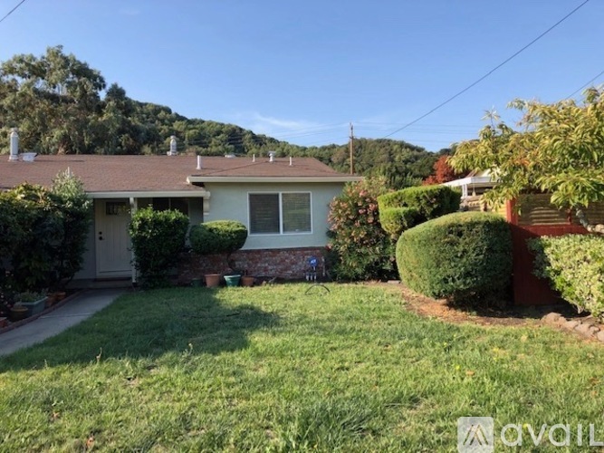 A house with a white door and a small front yard.
