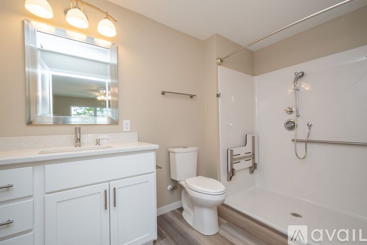 A bathroom with a white toilet, sink, and bathtub.